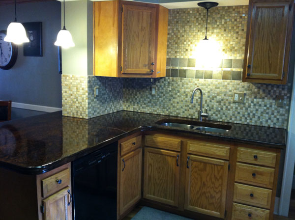 Glass Tiled Back Splash with Acid Stain Concrete Countertop